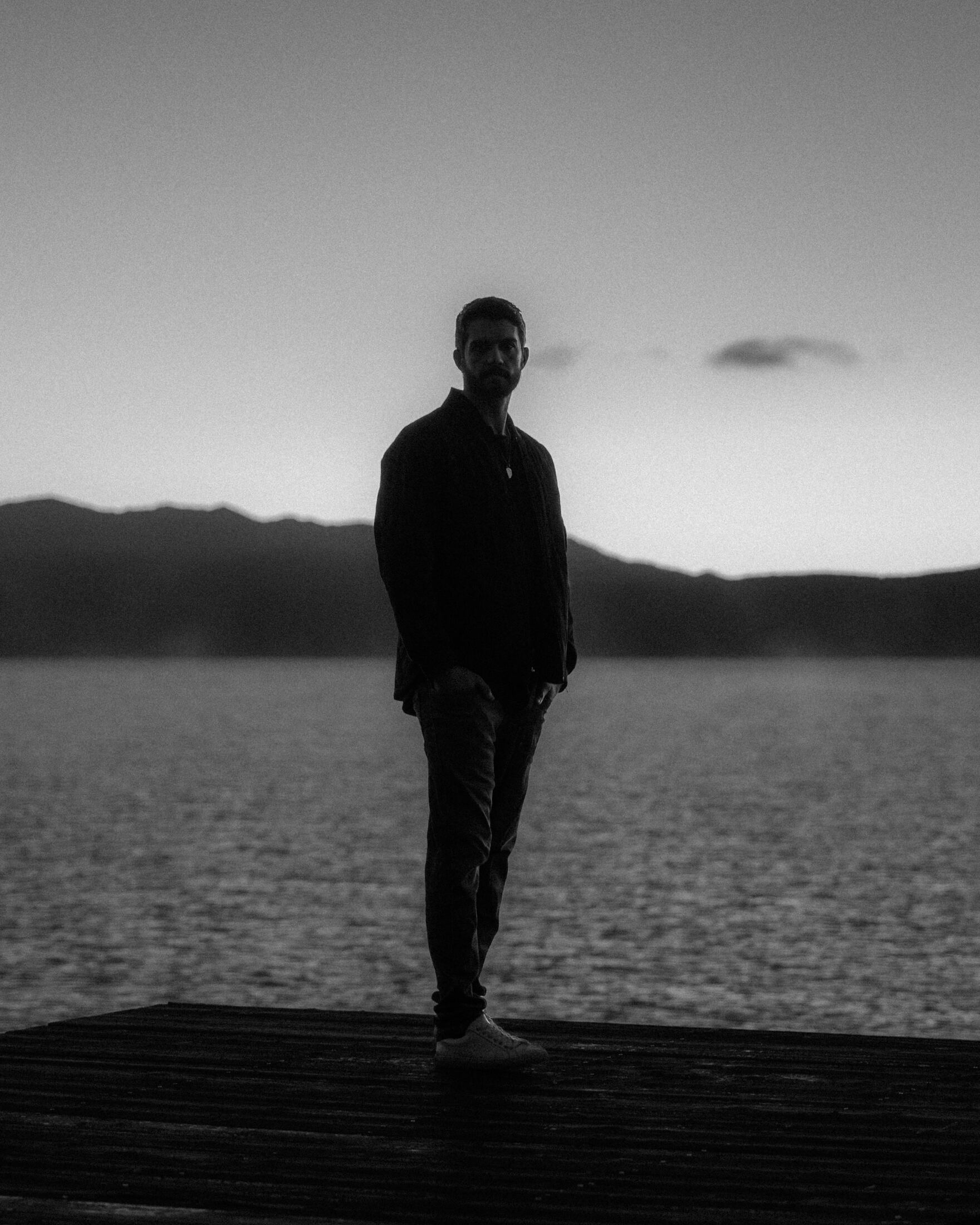 Black and white photo of MKE standing on a dock